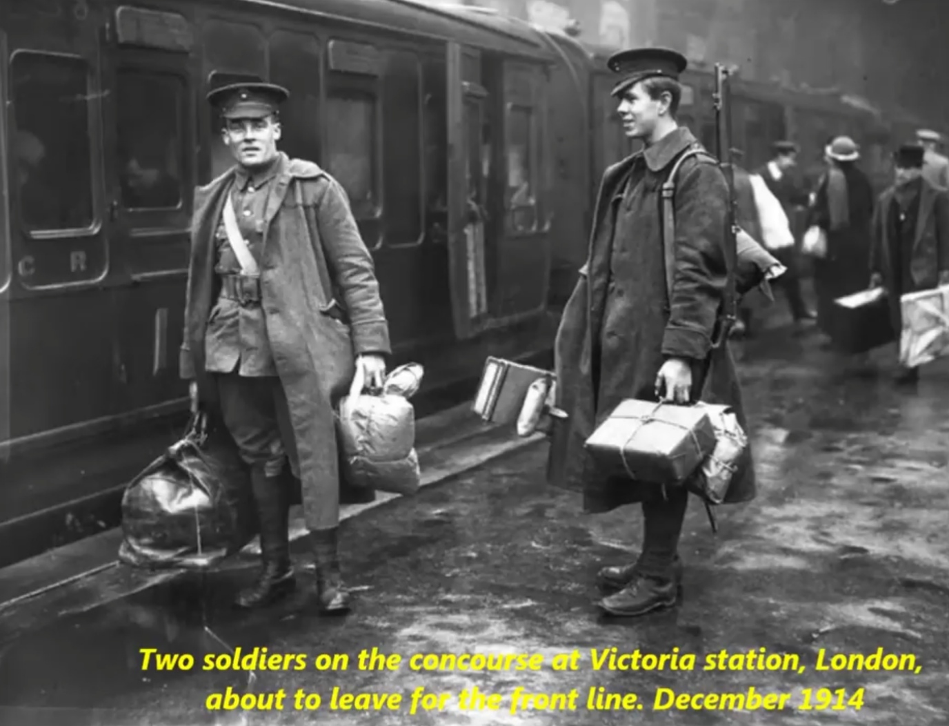 men leaving for war - Two soldiers on the concours at Victoria station, London, about to leave fo n t line.