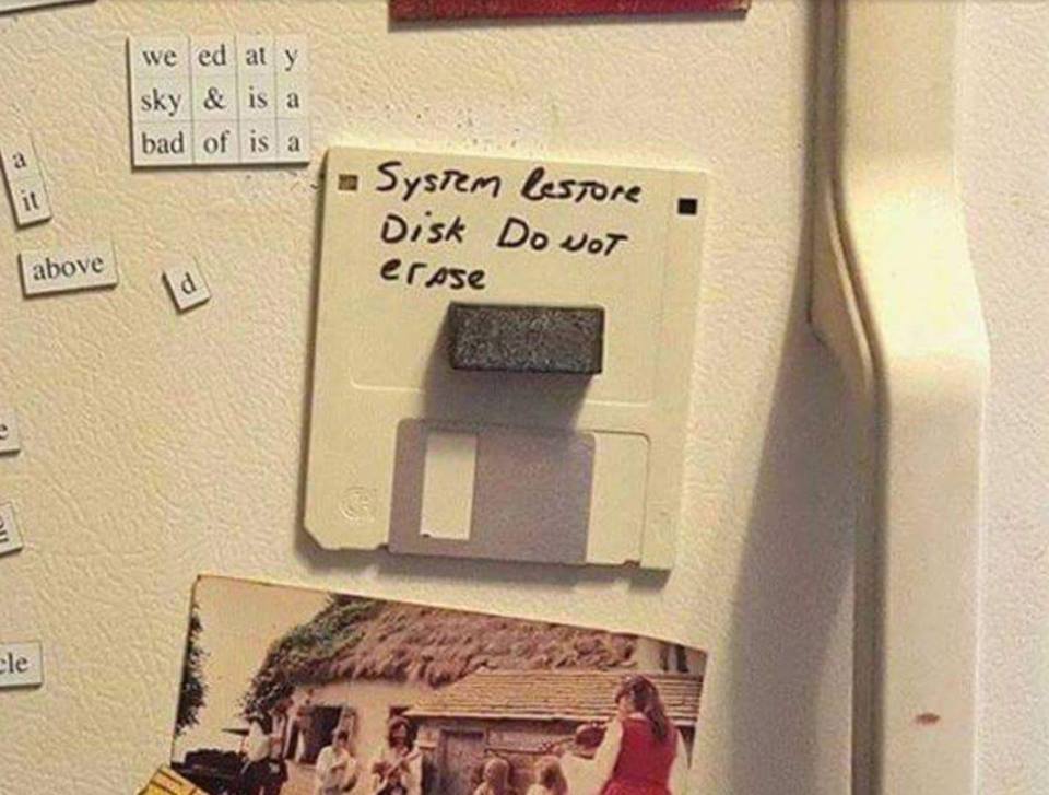 floppy disk on refrigerator - we ed at y sky & is a bad of is a System lestore Disk Do Not erase above cle