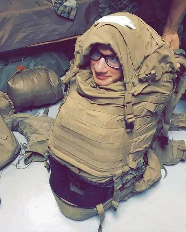 cursed_marine stuffed in backpack