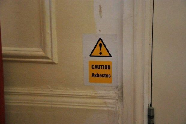 wtf hotel sign - Caution Asbestos