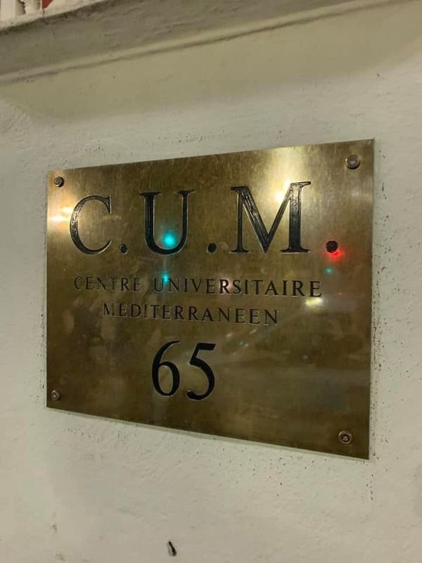 metal sign that says cum