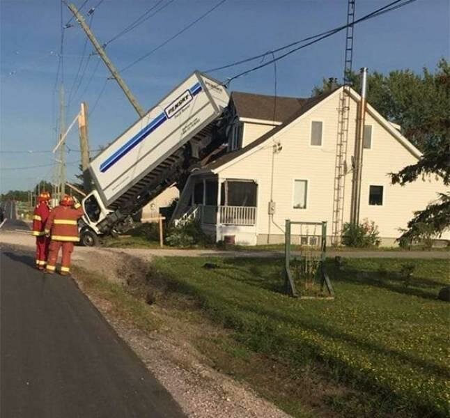 truck lands on roof of house