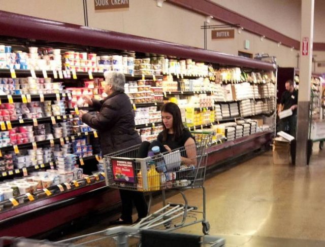 adult in a shopping cart