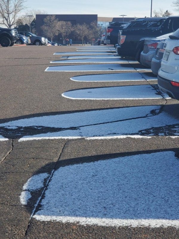 satisfying pictures - asphalt melting snow blocked by cars