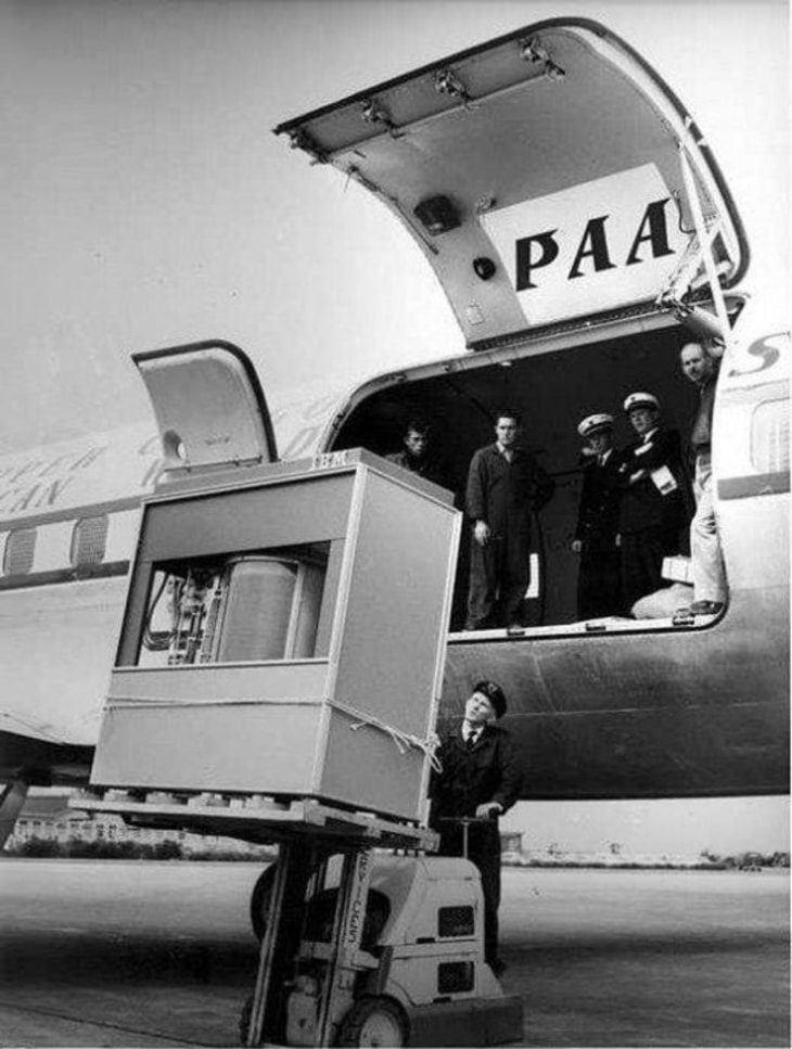5MB hard drive being loaded for transport on pan am flight, 1961.