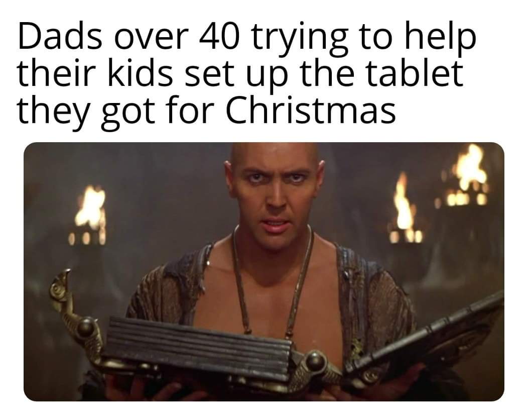 photo caption - Dads over 40 trying to help their kids set up the tablet they got for Christmas