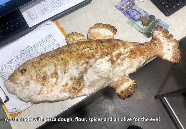 fish - A fish made with pizza dough, flour, spices and an olive for the eye!