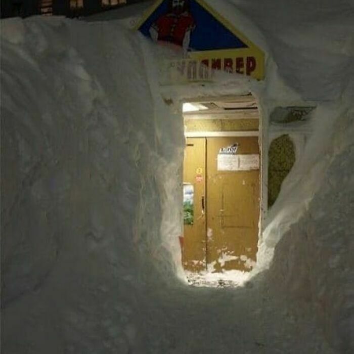cool winter pics - russia snow storm burying building