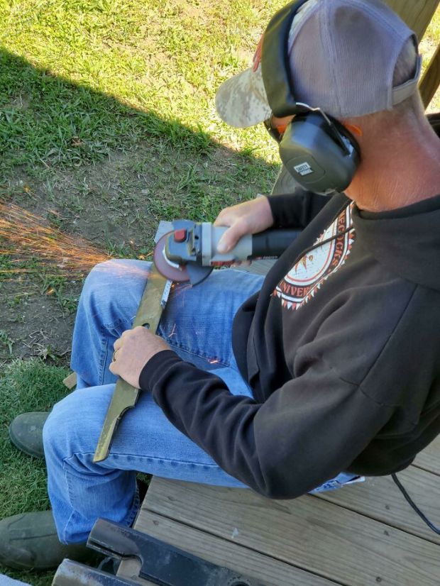 sharpening a lawn mower blade with ppe - Ecocess