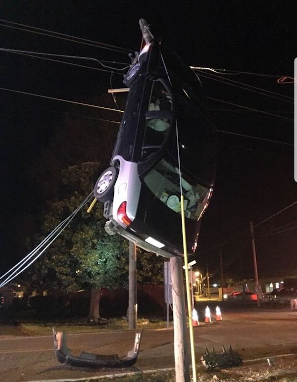 unluckiest people ever - car stuck on pole