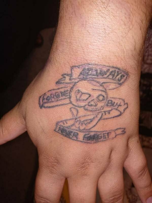 An all-around confusing tattoo that almost looks like it was smudged. 