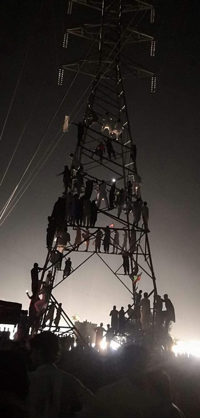 construction fails  - group of people on an electrical tower