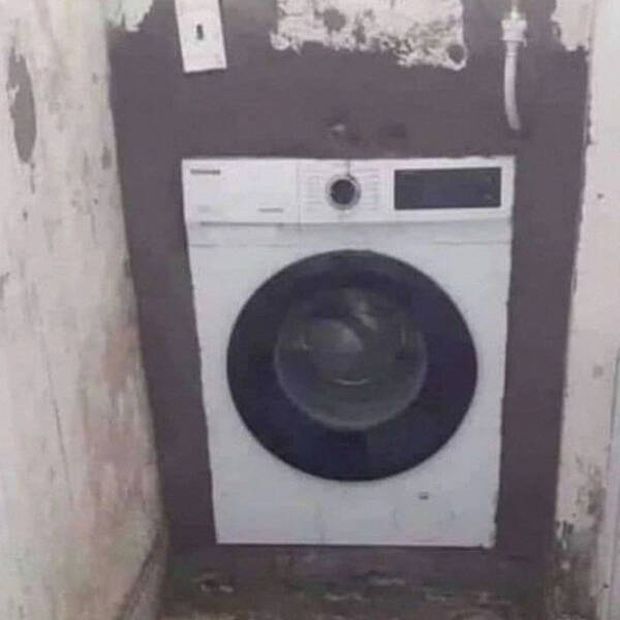 construction fails  - laundry machine inside a wall