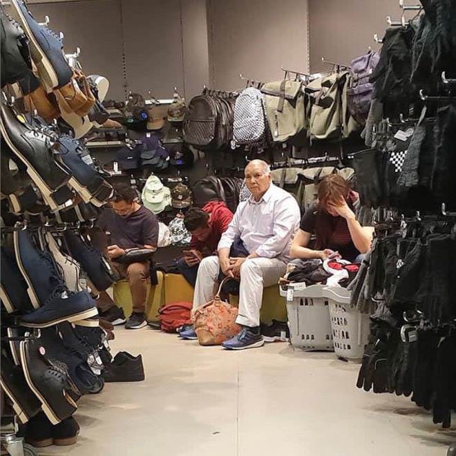 pictures of men shopping - men shopping with wife - Sad