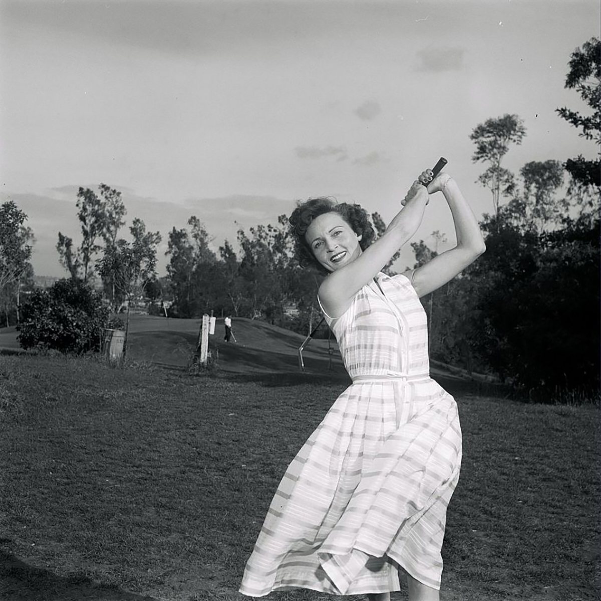 Betty White playing golf in the 1950s.
