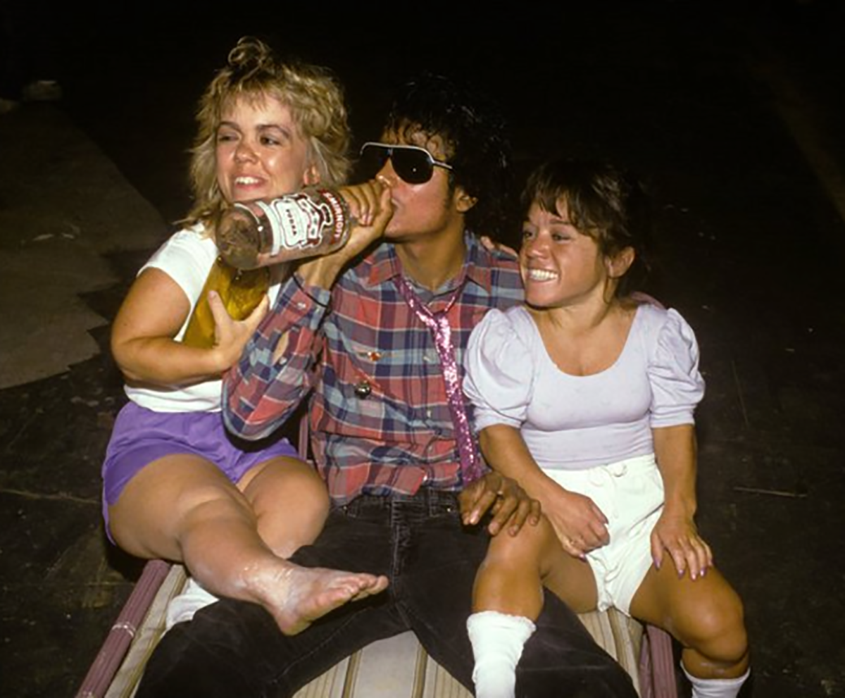 Michael Jackson has a drink in the 80s.