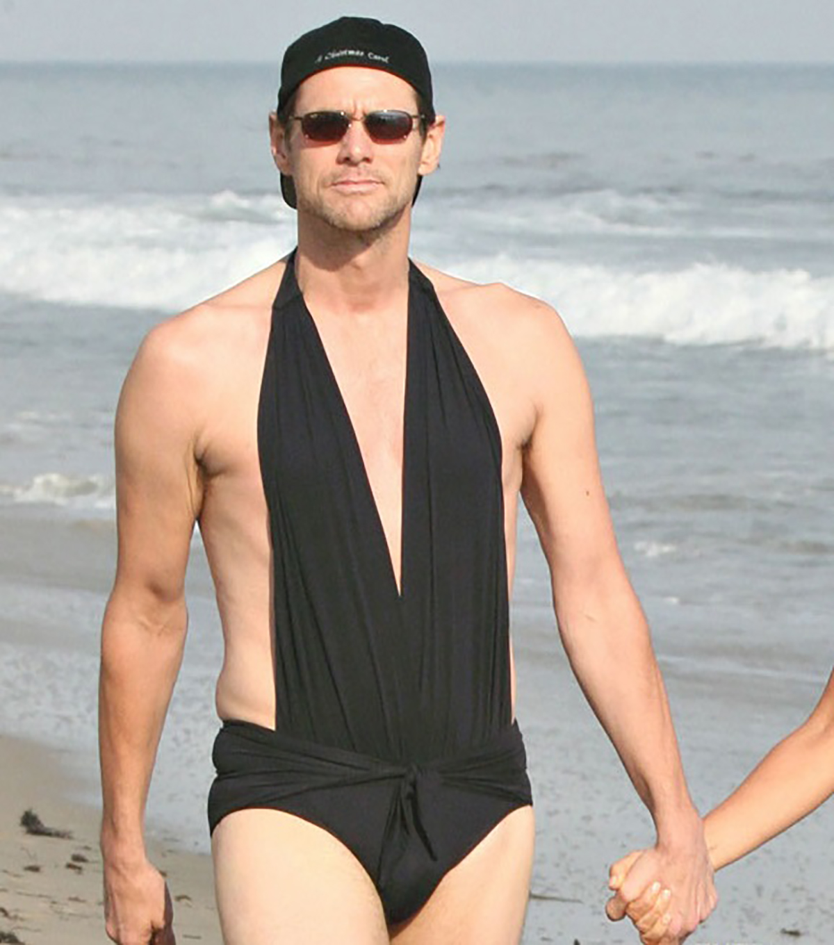 Jim Carrey staring at the paparazzi while wearing Jenny McCarthy's bathing suit in 2008.