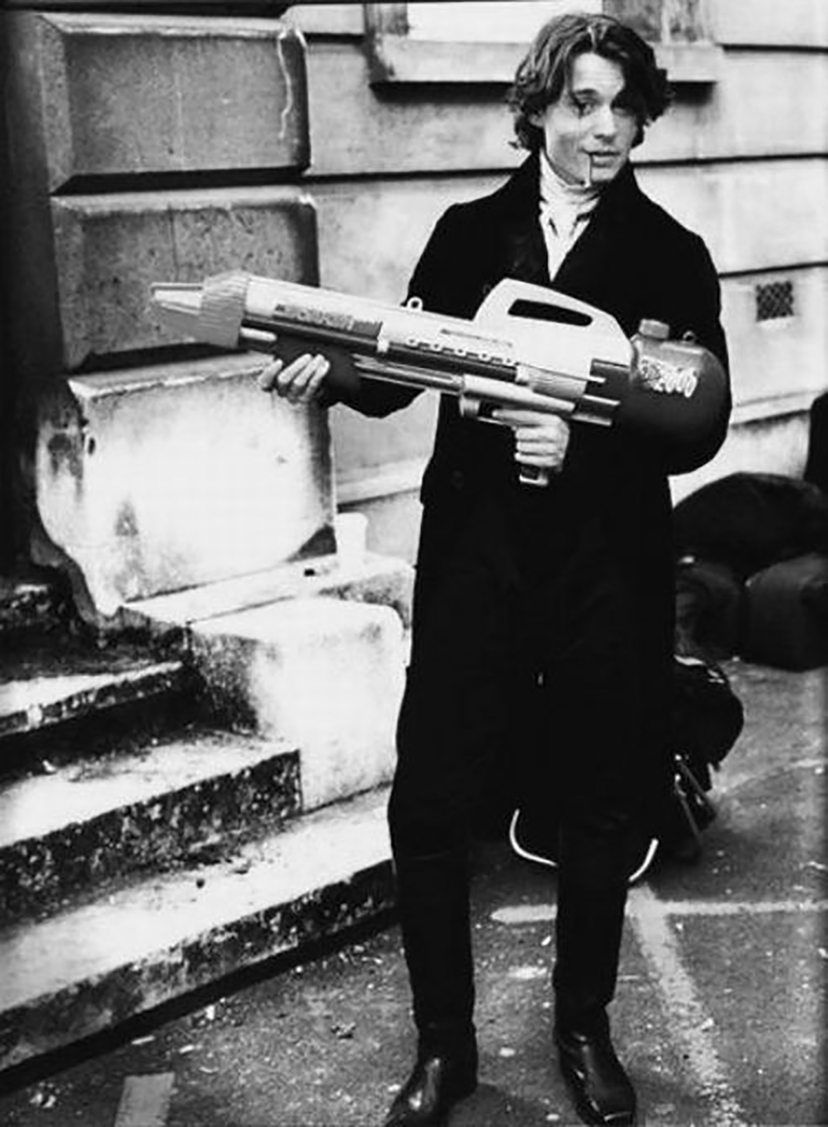 Johnny Depp with a super soaker on the set of Sleepy Hallow (1999).