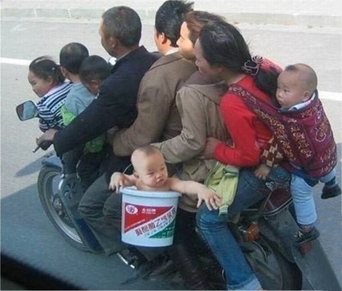 random thai family on motorbike