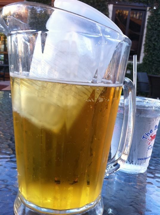 Put a cup of ice in a pitcher of beer to keep it cool: