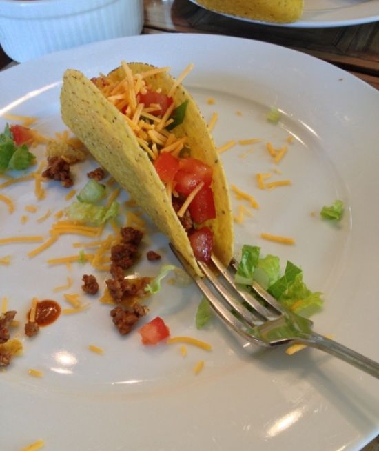 Make filling a taco easy by putting a fork under it like this