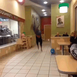 gifs - person does back flips across a hallway