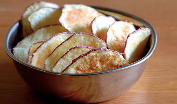 So re-crisping potato chips is cool but actually making them is cooler! The hardest part comes first. Slice some potatoes as thin as you can and arrange them on a plate. Now microwave them in 3 minute bursts.