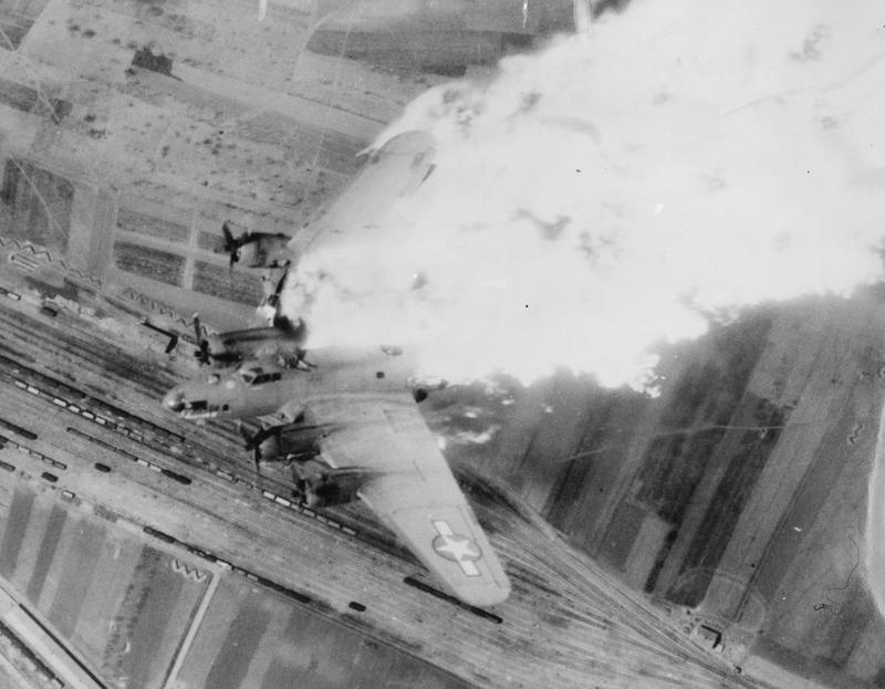 A B-17 of the US Fifteenth Air Force breaks up in flames after being hit by flak over a railyard at Nis, Yugoslavia - 15th April 1944.