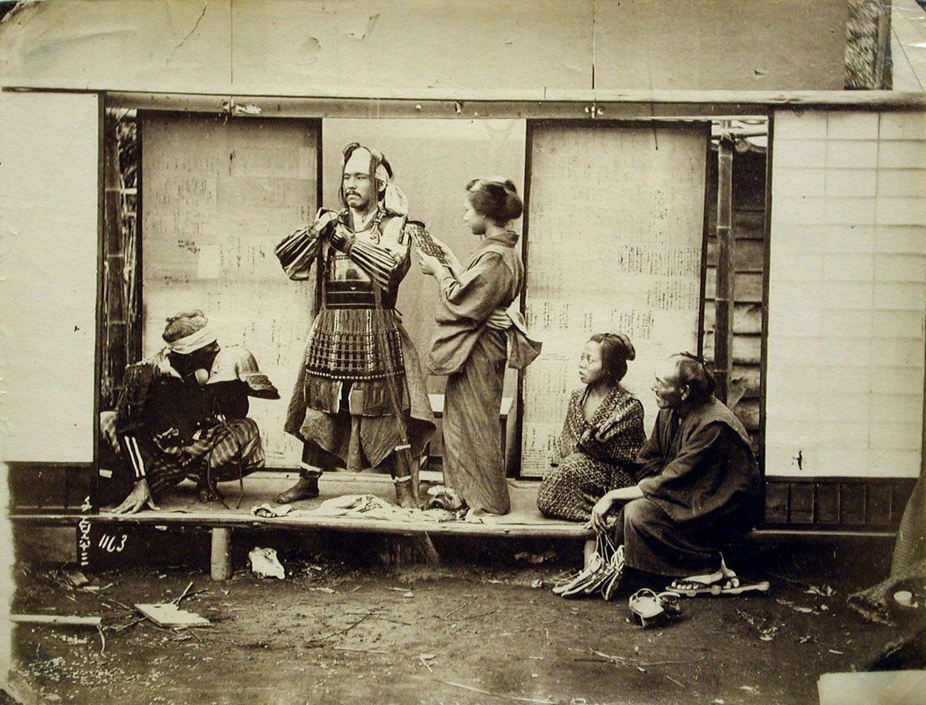 Samurai equipping his armor (Japan - c. 1860-1880).