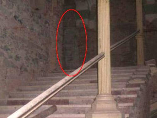 The Decebal Hotel is a 150-year-old hotel in Romania. There's a rumor going on about a ghost of a tall woman in a long white frock haunting the spa. No evidence for this ghost existed until 2008 when 33-year-old Victoria Iovan photographed her boyfriend at the aforementioned location, with the legendary apparition in the background.