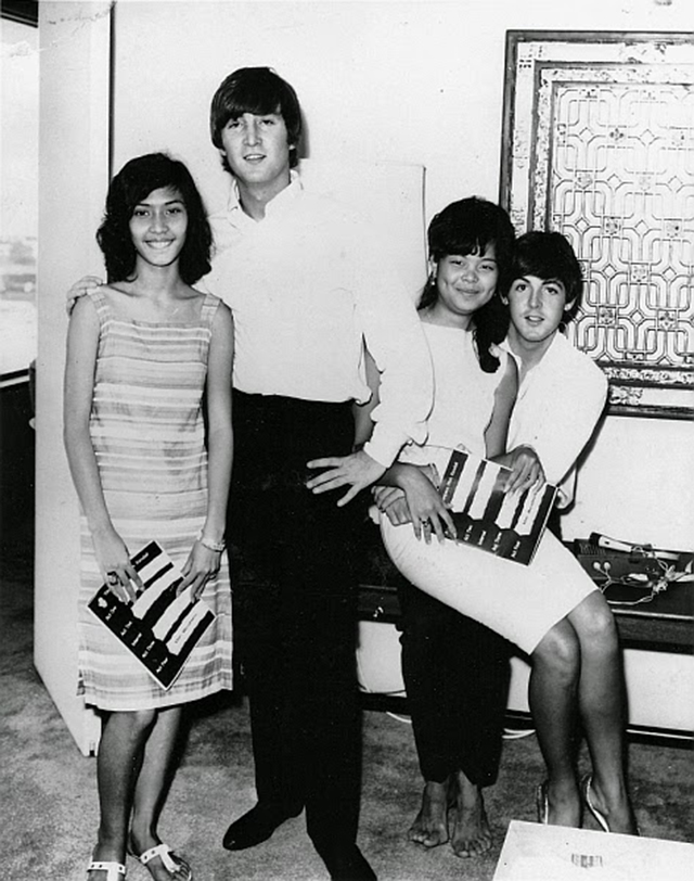 John Lennon​ and Paul McCartney​ of The Beatles​ with two fangirls in Hong Kong, 1964.