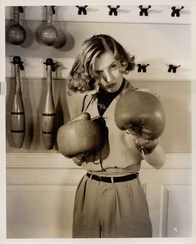 Barbara Stanwyck with boxing gloves, 1950s.