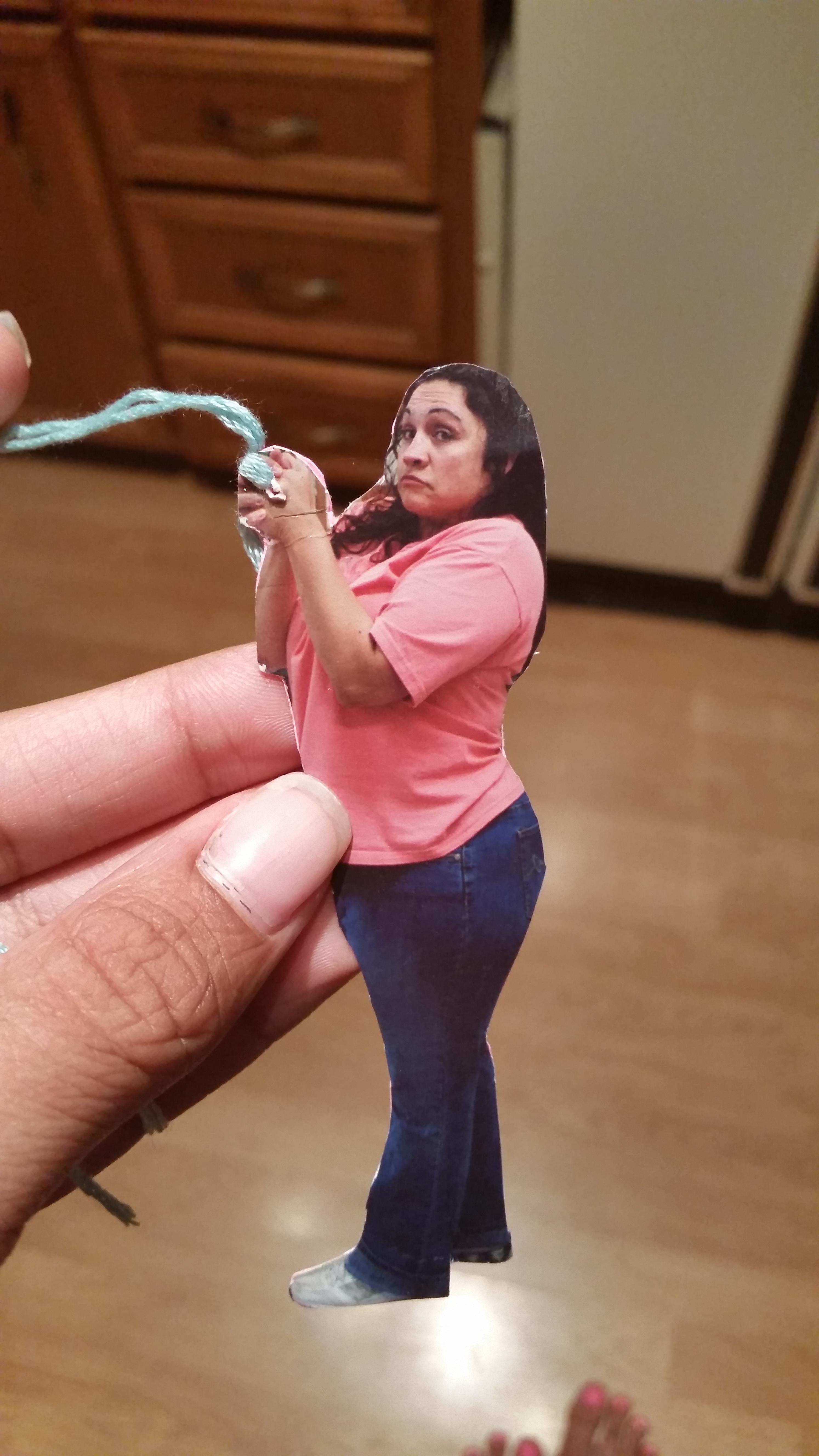 A girl asked her mom for a cool bookmark. This is what she gave her (that's her mom on the cutout)