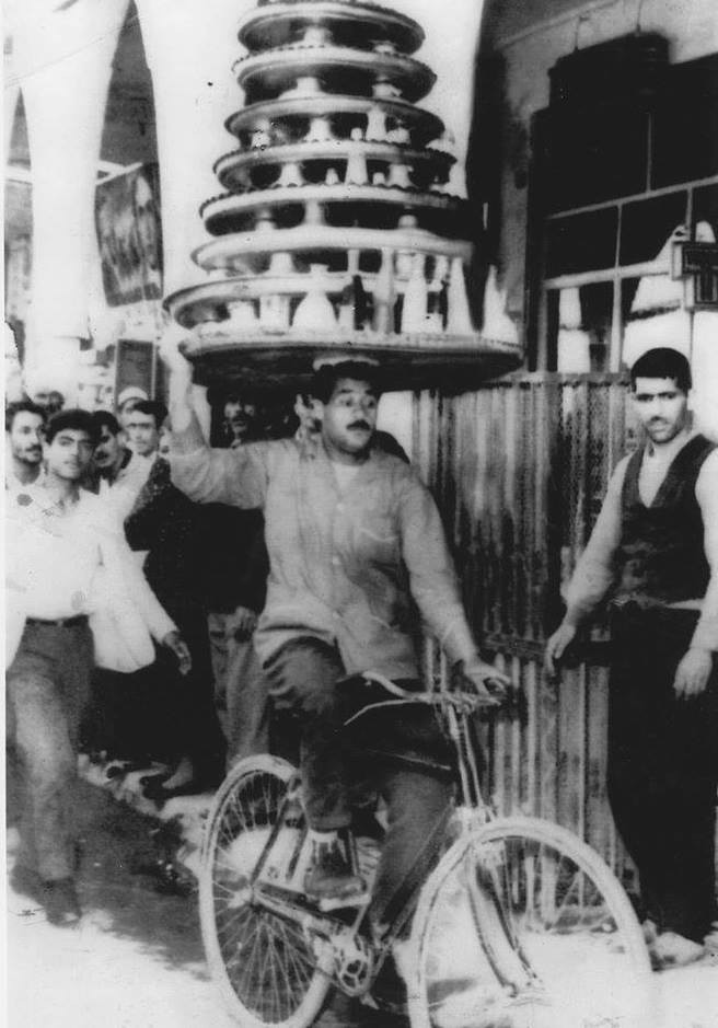 The art of serving food among merchants in Tehran's Bazaar - Iran (1950's).