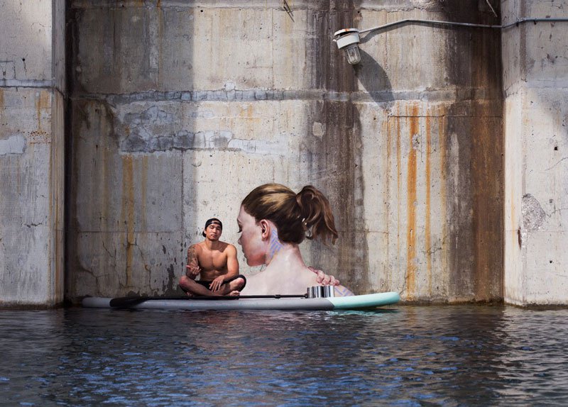 Sean Yoro aka HULA has been painting beautiful portraits in NYC, using his paddleboard to get to hard to reach places.