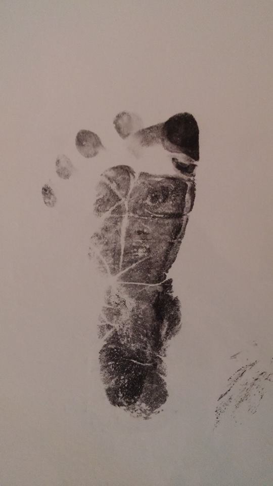 An actual hospital footprint of a newborn. Look closer.