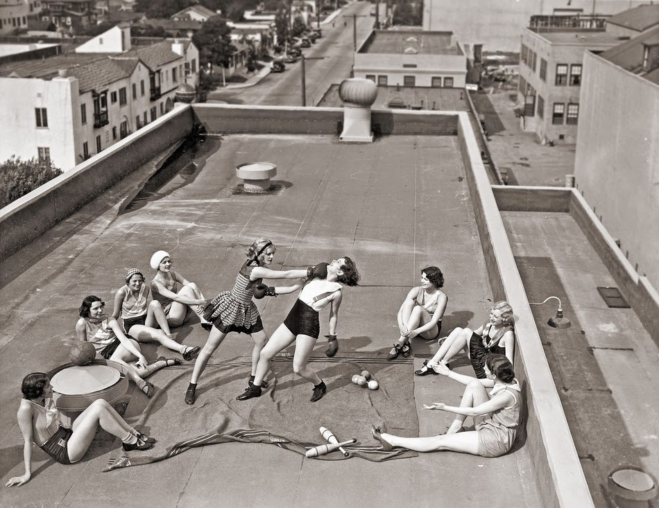 Women boxing on a roof, ca. 1930s.
