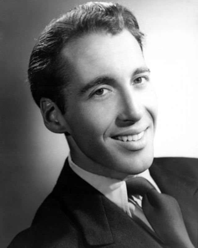 A young Christopher Lee poses for a press photo, 1940s.