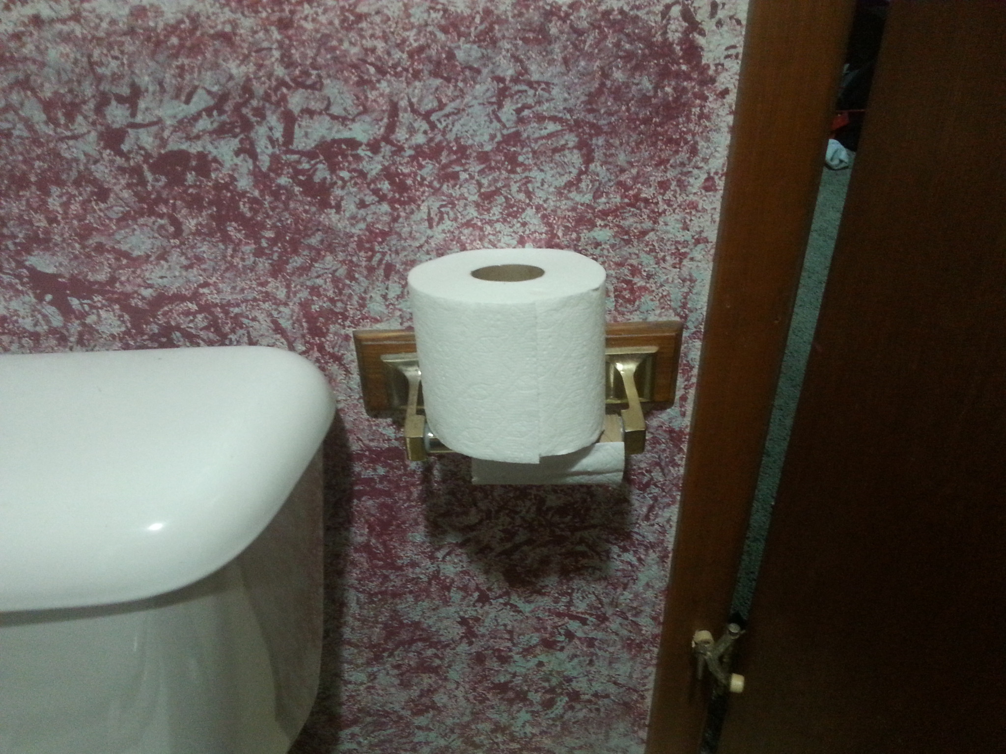 toilet paper roll put on top of the holder