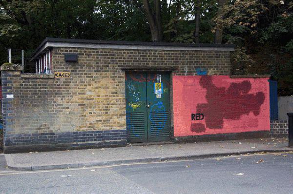 paint over graffiti red brick - Kake Red