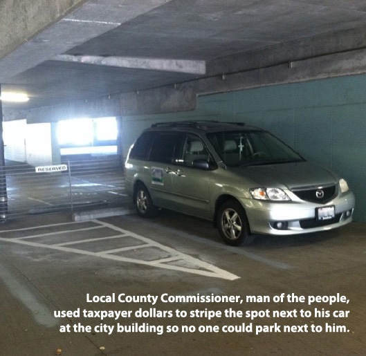 dubai international school - Local County Commissioner, man of the people, used taxpayer dollars to stripe the spot next to his car at the city building so no one could park next to him.