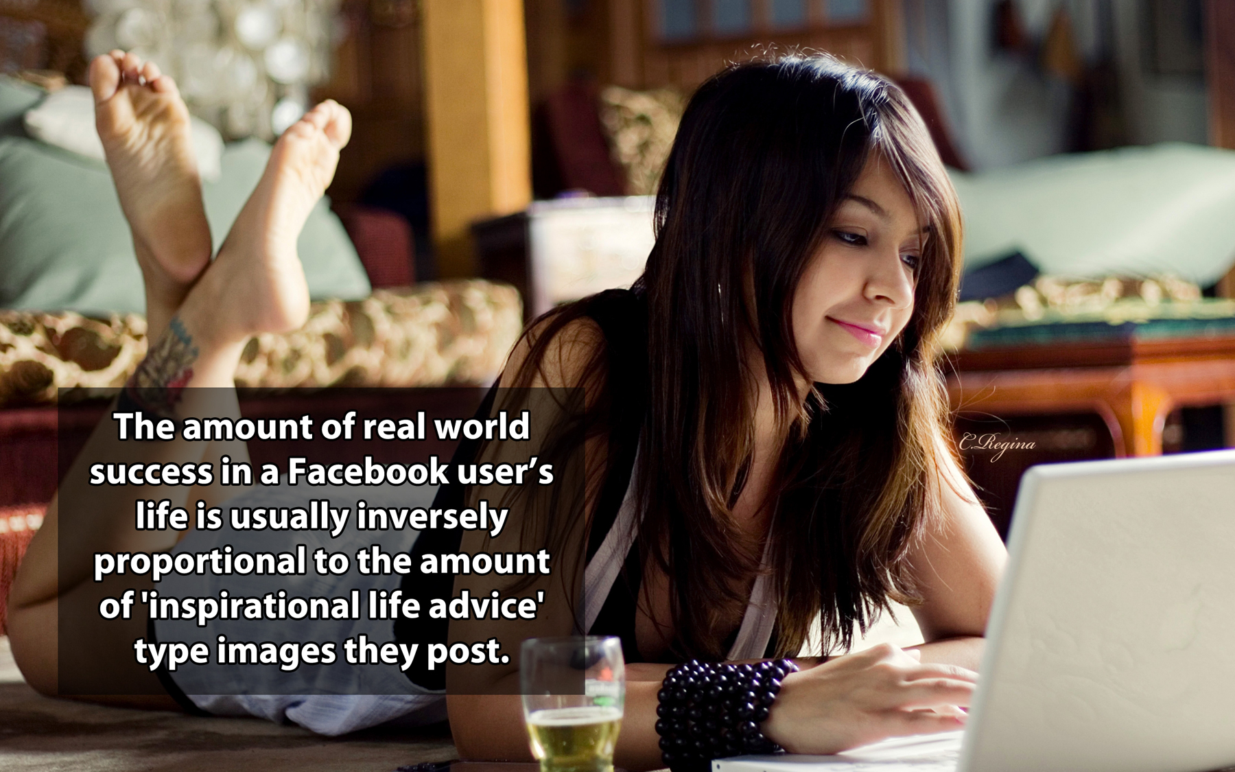 girl on the computer - The amount of real world success in a Facebook user's life is usually inversely proportional to the amount of 'inspirational life advice' type images they post.