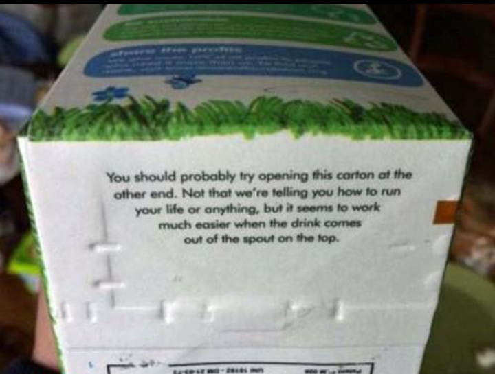 bottom of milk carton - You should probably try opening this carton at the other end. Not that we're telling you how to run your life or anything, but it seems to work much easier when the drink comes out of the spout on the top. Elo