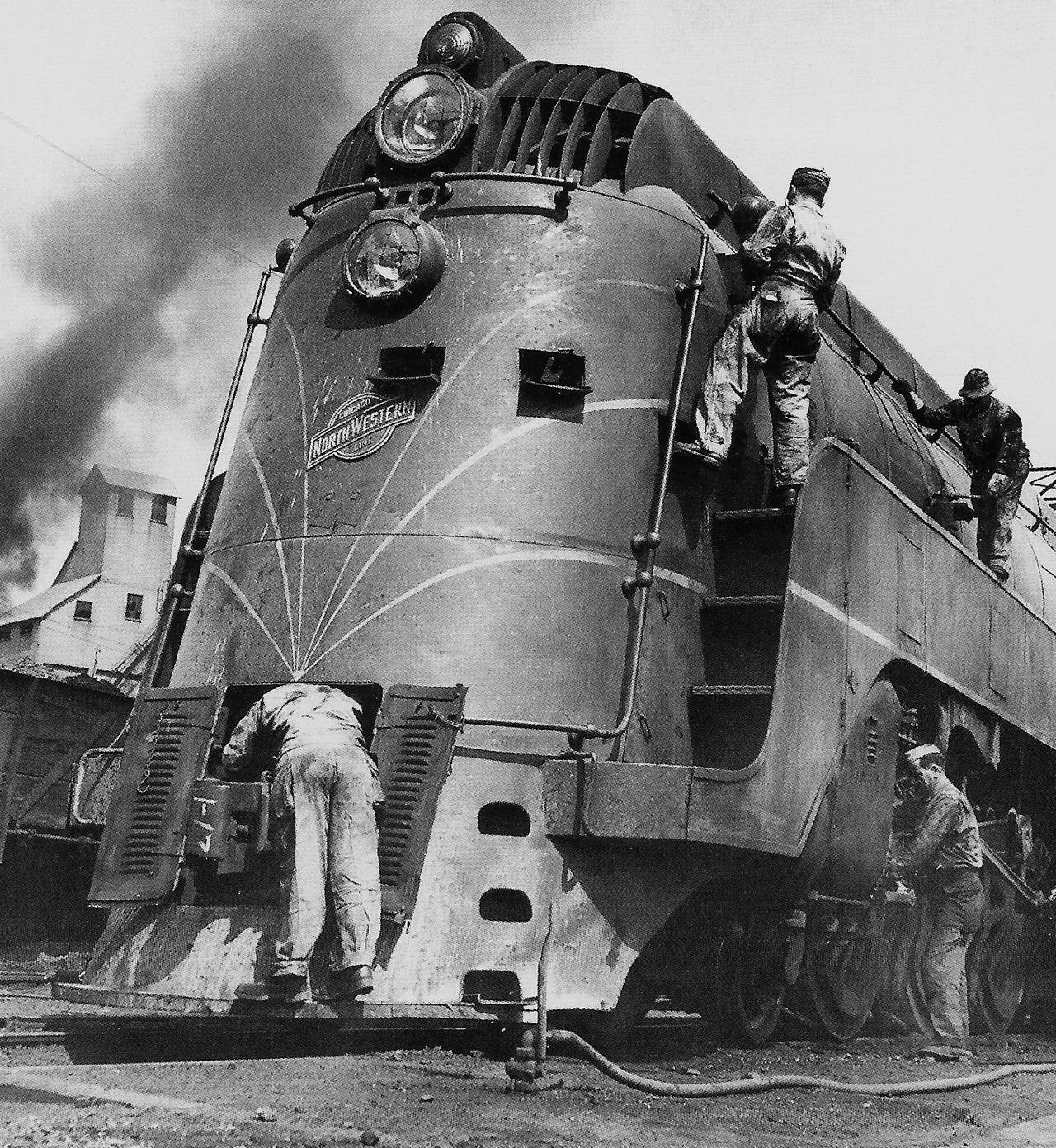 Soldiers working on a locomotive, Chicago, 1945.