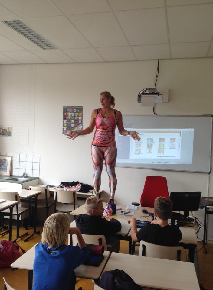 Biology teacher Debby Heerkens undresses in front of her students.