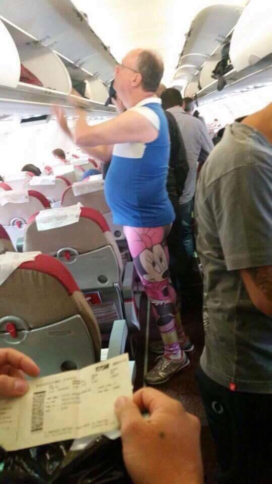 cringe man in minnie leggings on plane