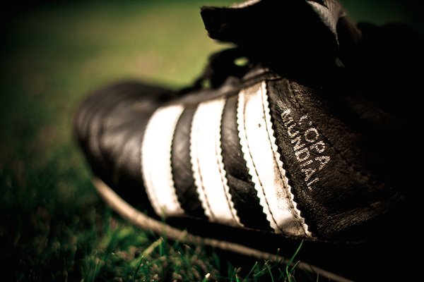 In Soccer, if you take off your shoe to throw it and hit the ball, it counts as a handball.
