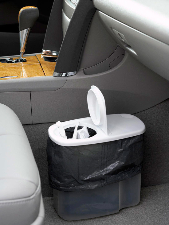 For a trash can in your car, simply re-use an old plastic cereal dispenser.