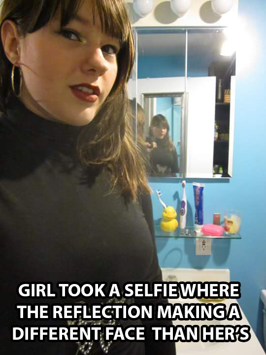 photo caption - Girl Took A Selfiewhere The Reflection Making A Different Face Than Her'S