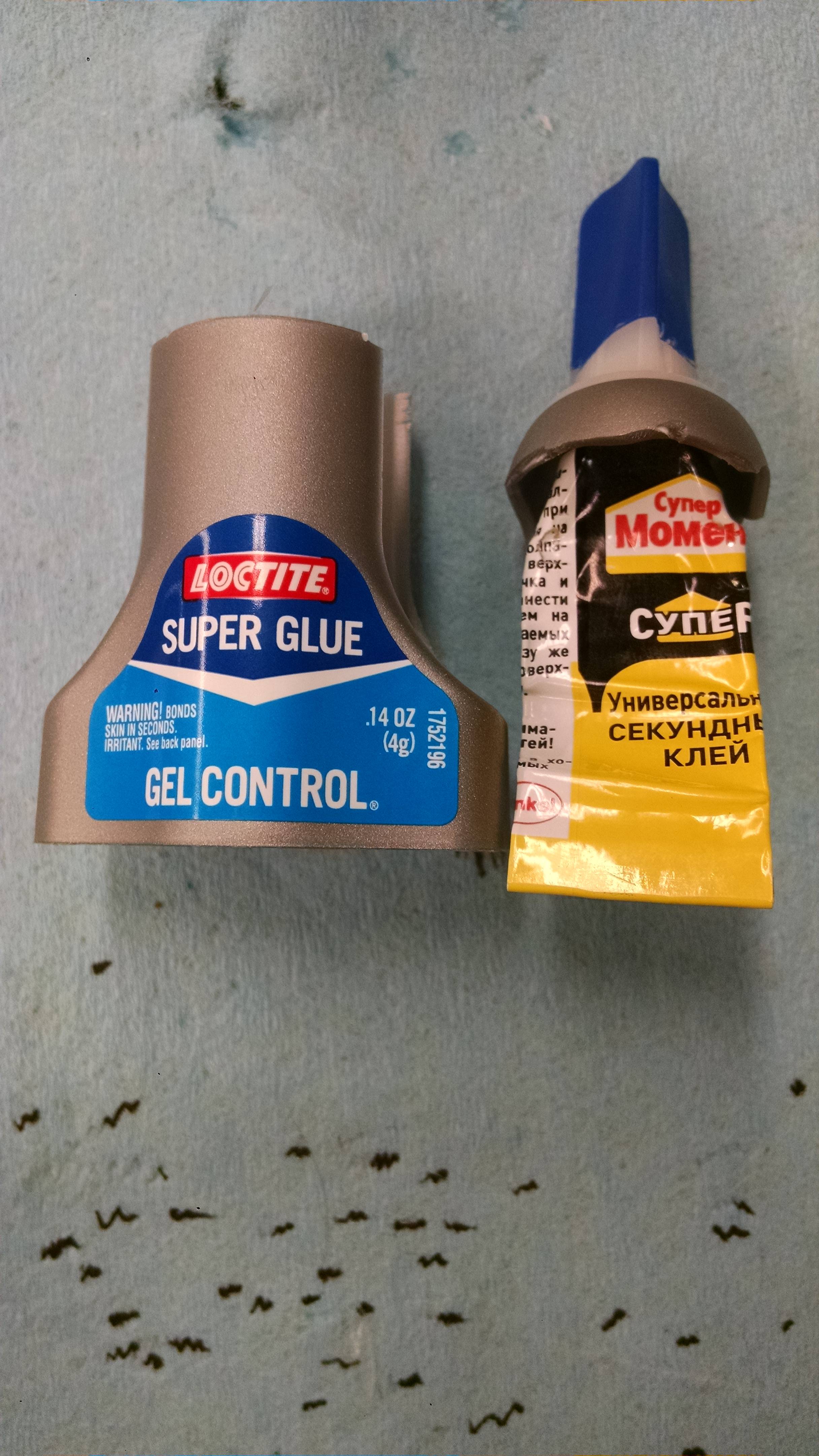 Cut this super glue out of its plastic container (US) and found a 

Russian variety.